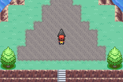 The player standing directly below the black triangle on Birth Island’s stone plateau