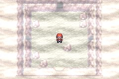 The foggy third room of the Lost Cave with six rocks on its floor, the player in the middle facing the south exit