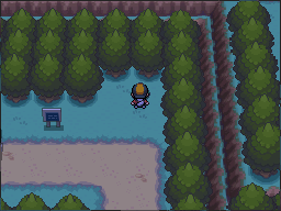 The blue-Apricorn tree stands in the clearing beside the sign and the eastern cliff. in Pokémon HeartGold.