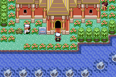 The player at the arched door of the gold-roofed Battle Palace, between flower beds above the water
