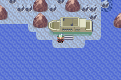 The Abandoned Ship aground on Route 108, the player standing in the shallows beside the grey steps up to its hull