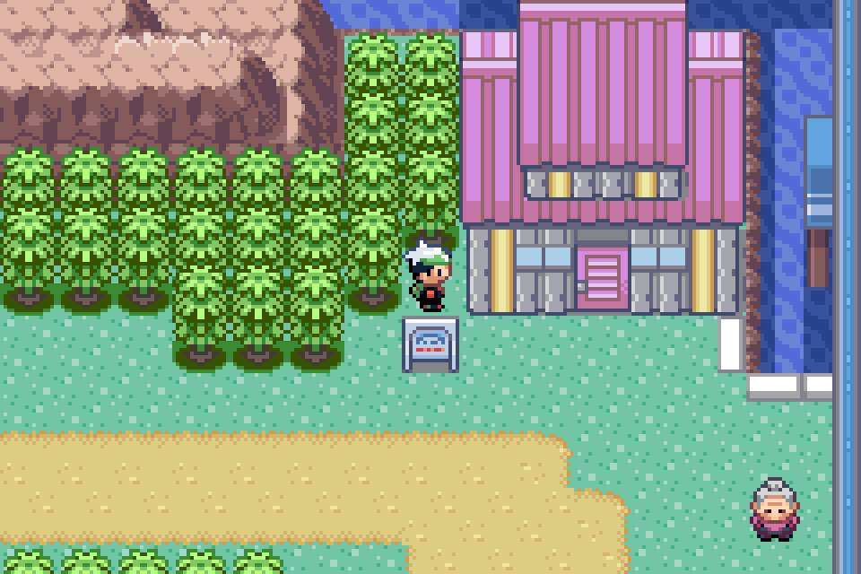 The player beside the Trick House and its sign on Route 110 in Pokémon Emerald