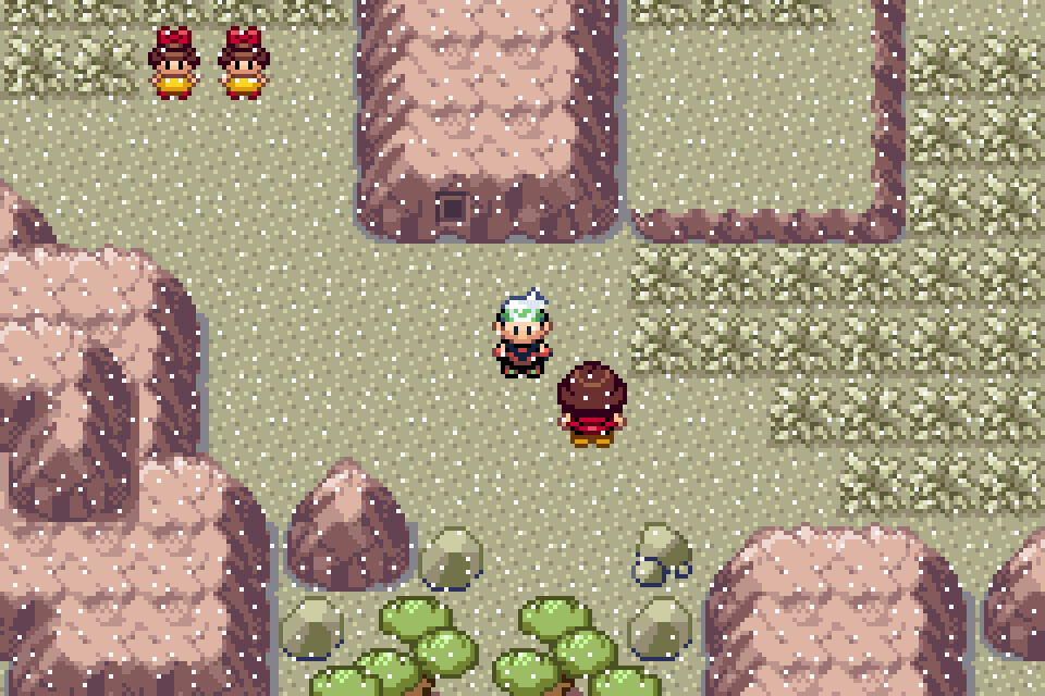 The player beside ash-covered grass on Route 113 in Pokémon Emerald